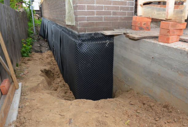 SJ Waterproofing Pros technician performing targeted Wet Basement Repair assessment in Chesterfield, SC